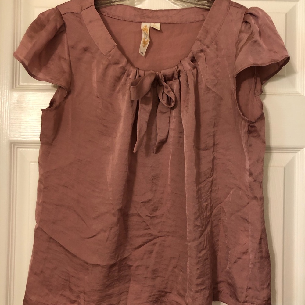Deep rose pink, cap sleeved blouse.